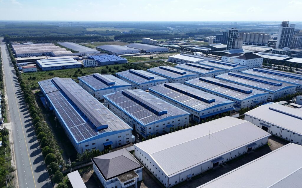 Aerial view of industrial buildings in Thành phố Thủ Dầu Một, Bình Dương, showcasing extensive solar panels.
